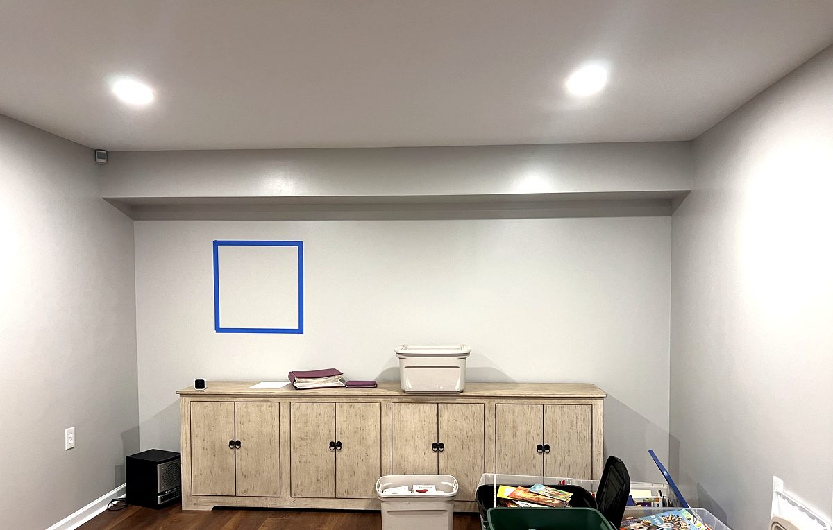 Finished basement game room with recessed lighting and media center