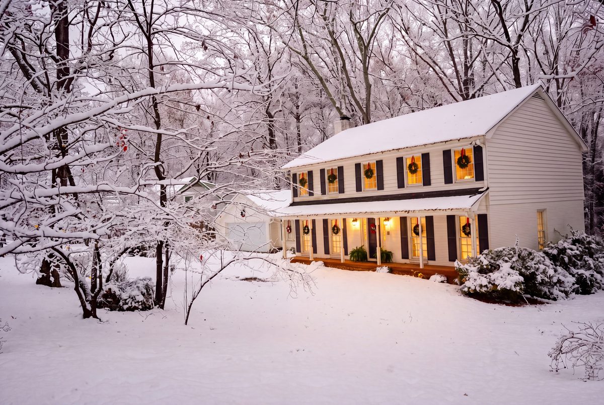 785 Spalding Drive on a snowy winter evening with wreaths in every window